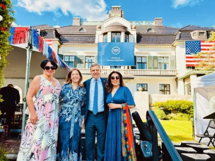Annie Schur with U.S. Chargé d'Affaires Eric Meyer and Noor Sabah Traavik at the U.S. 250th Independence anniversary reception in Oslo.