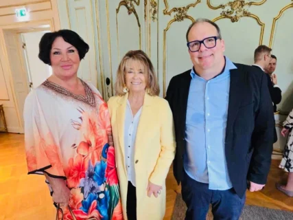 Annie Schur and Robert Schur with cultural icon Wenche Myhre at a reception in Oslo.